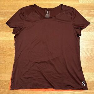 On Running Women’s Performance T, size L. Maroon front, coral/orange back.
